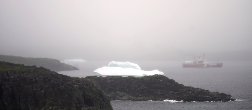 An iceberg floats outside the entrance to the harbor at St. Anthony, Newfoundland.