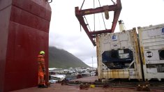 he crew of the Bruarfoss loads a refrigerated container packed with frozen fish. The Bruarfoss is in Isafjordur, a small port on the northwest coast of Iceland.