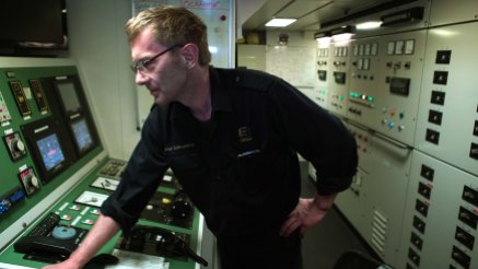 Hjortur Gudmundson, chief engineer on the Bruarfoss, monitors the performance of the engine.
